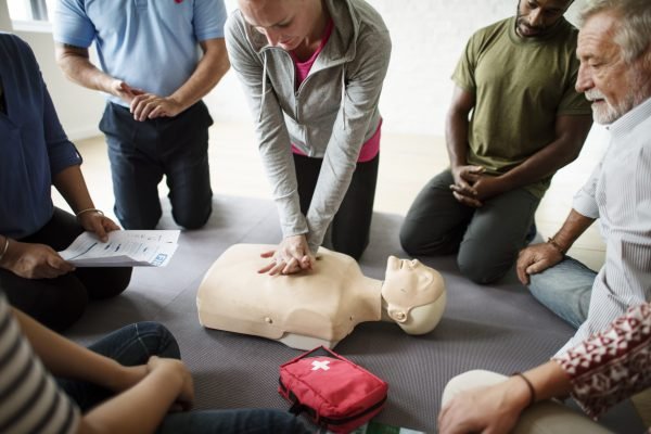 Group of diverse people in cpr training class Group of diverse people in cpr training class